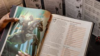 Dungeon Master's Guide being held behind a DM screen