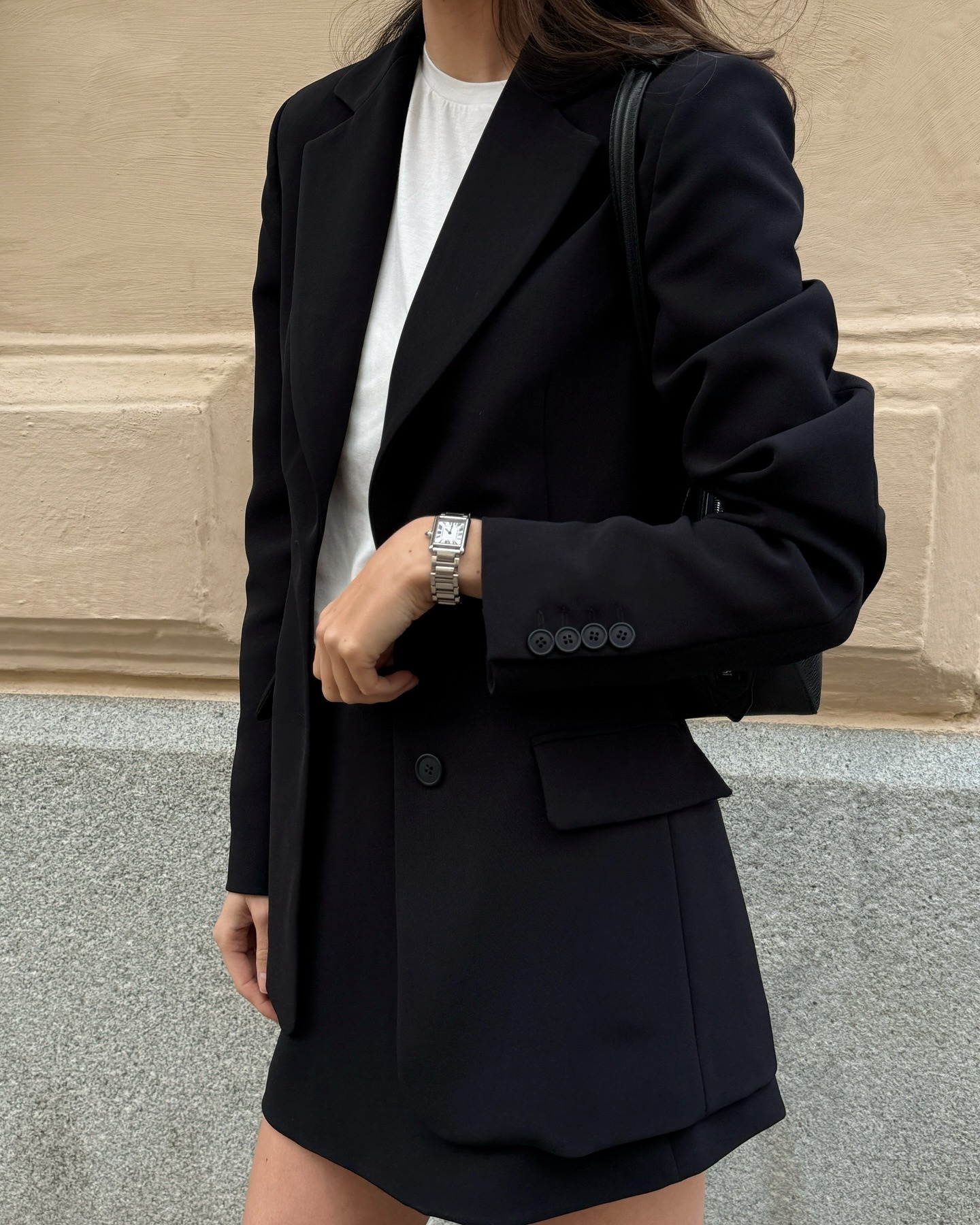 Woman wearing oversize blazer in street style shot.