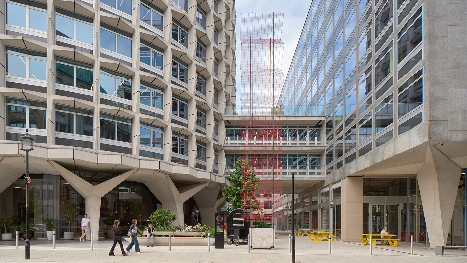 view of Rana Begum and Webb Yates installation LFA 2026, a red metal mesh piece in outside plaza