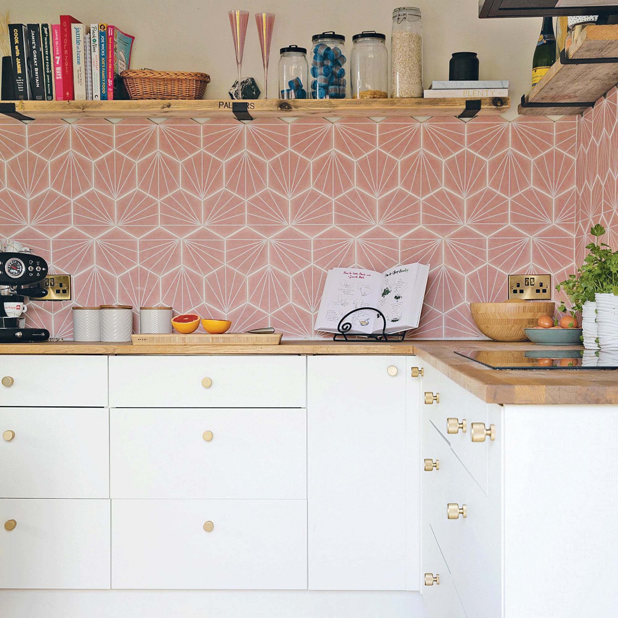 Pink tiles with open shelves and wooden countertops