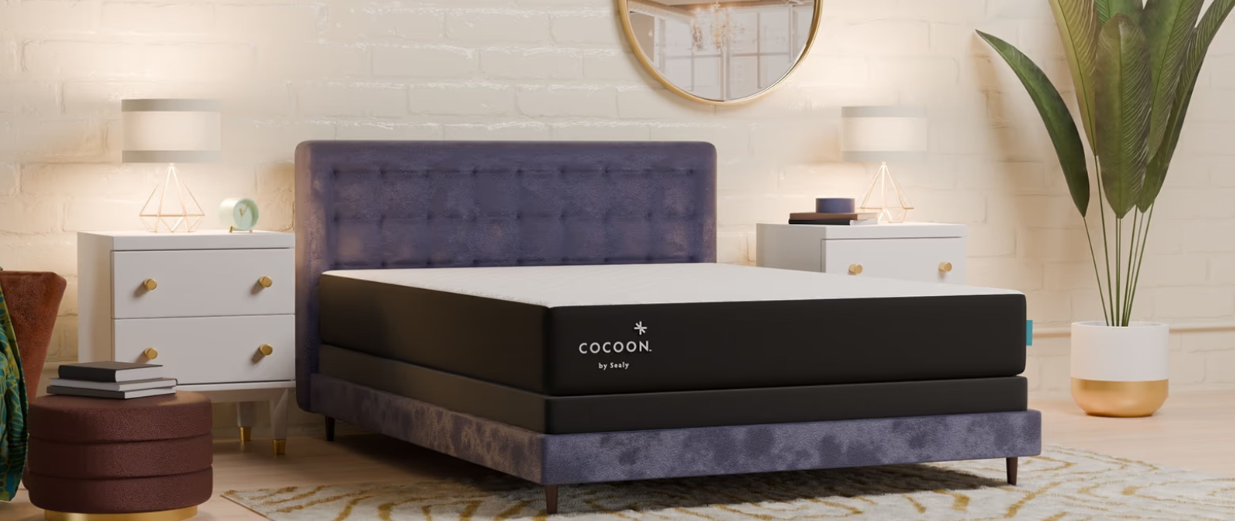 The black and white Cocoon by Sealy Chill mattress placed on a purple bed frame in a bedroom with a white brick wall, two bedside cabinets and a plant 