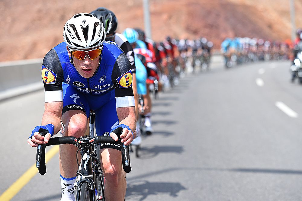 Iljo Kiesse drives the peloton.
