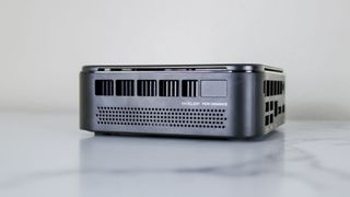 A side view of the Kamrui E3B mini PC showing off its cooling vent