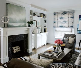 living room with fireplace and dark leather furniture