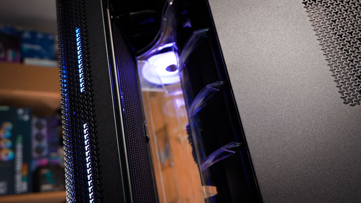 A Corsair Air 5400 PC case on a desk with various parts installed.