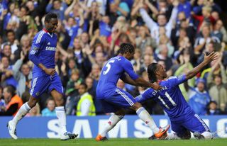 Didier Drogba celebrates with team-mates after scoring for Chelsea against West Brom in August 2010.