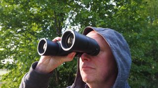 Nikon Action 10x42 binoculars in someone's hand