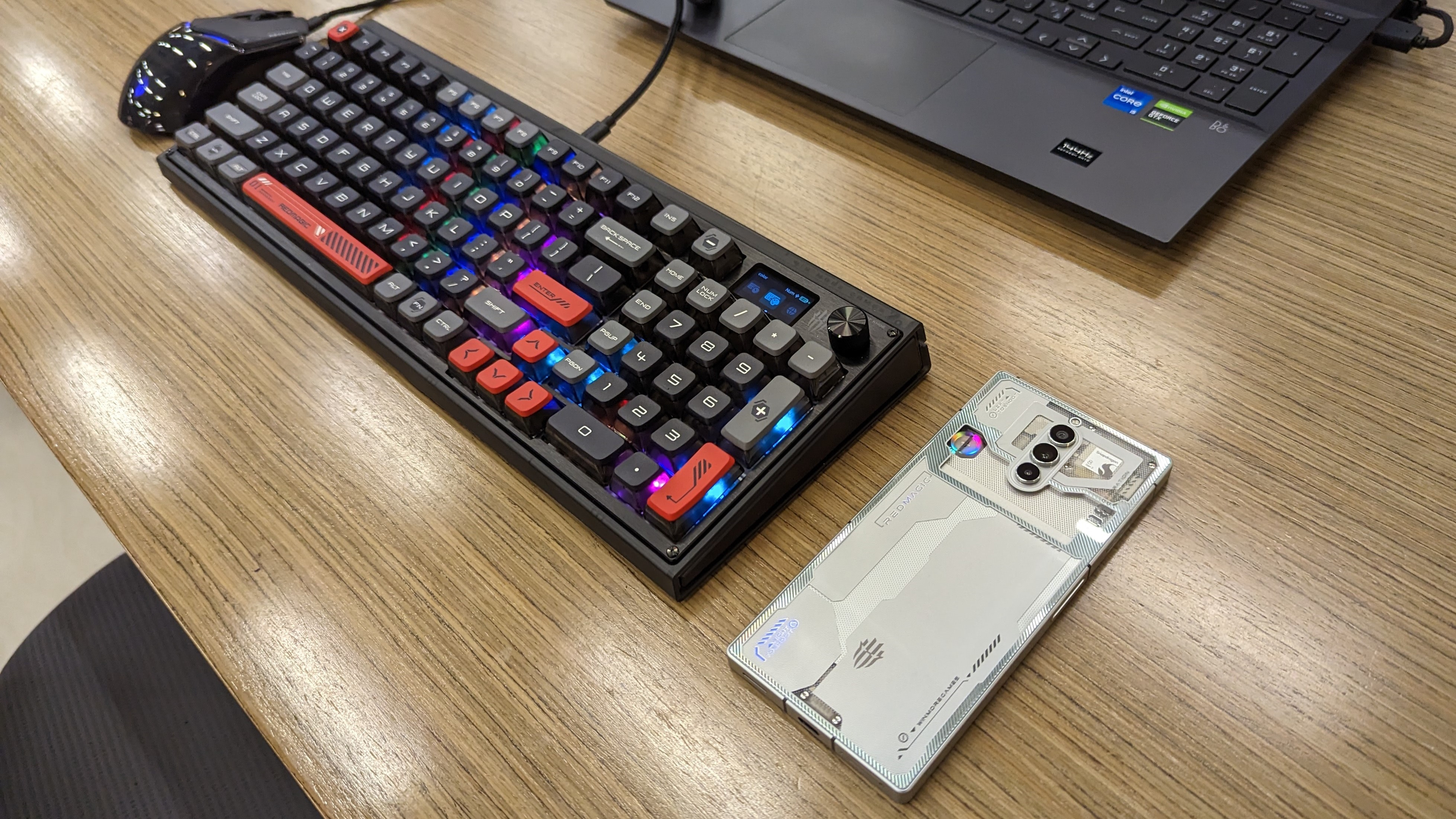 RedMagic 8 Pro, Mouse, and Mechanical Keyboard on a wooden desk.