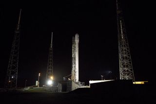 A SpaceX Falcon 9 rocket stands poised to launch the SES-8 communications satellite into orbit from Cape Canaveral Air Force Station, Fla. The November 2013 mission will be SpaceX's first launch of an upgraded Falcon 9 rocket from Florida.