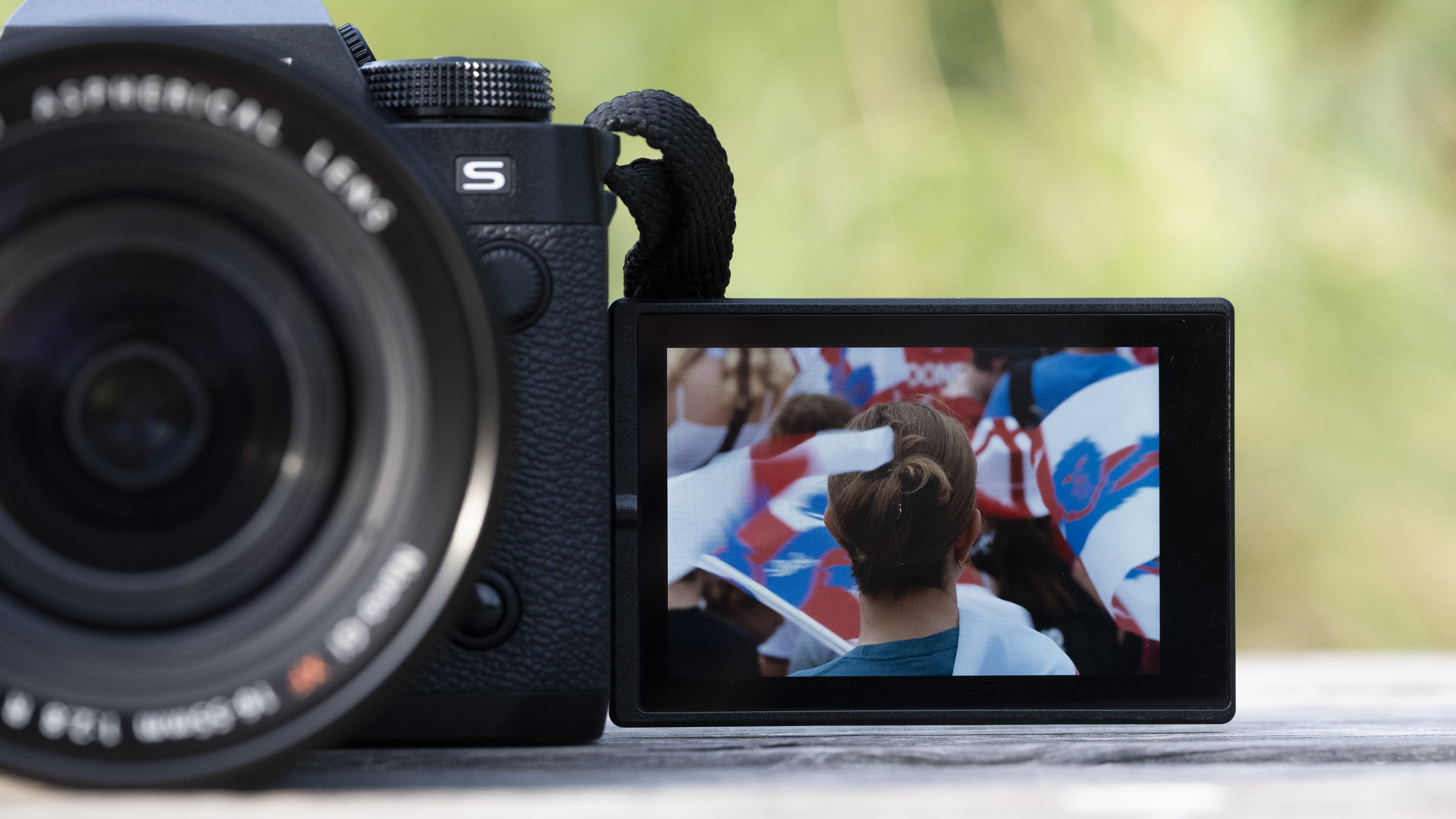 The Fujifilm X-H2S camera sitting on a wooden bench