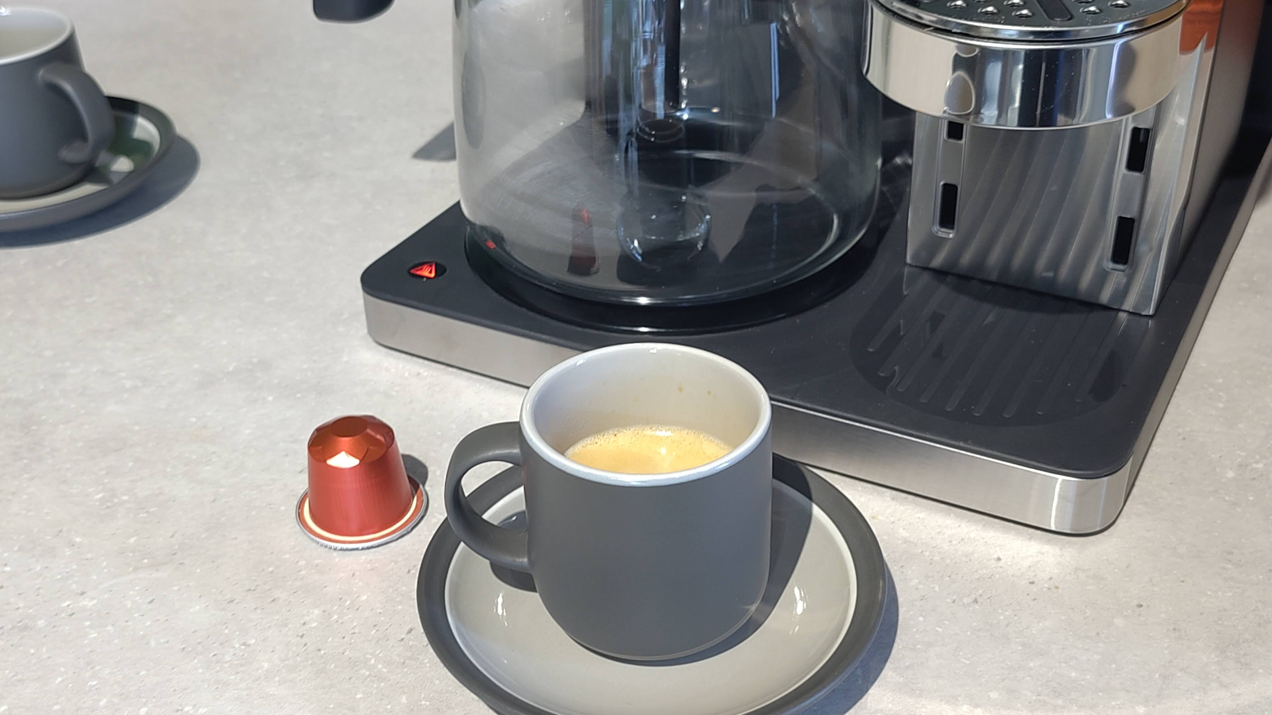 Ninja Prestige Dual-Brew System with coffee capsule and cup of espresso
