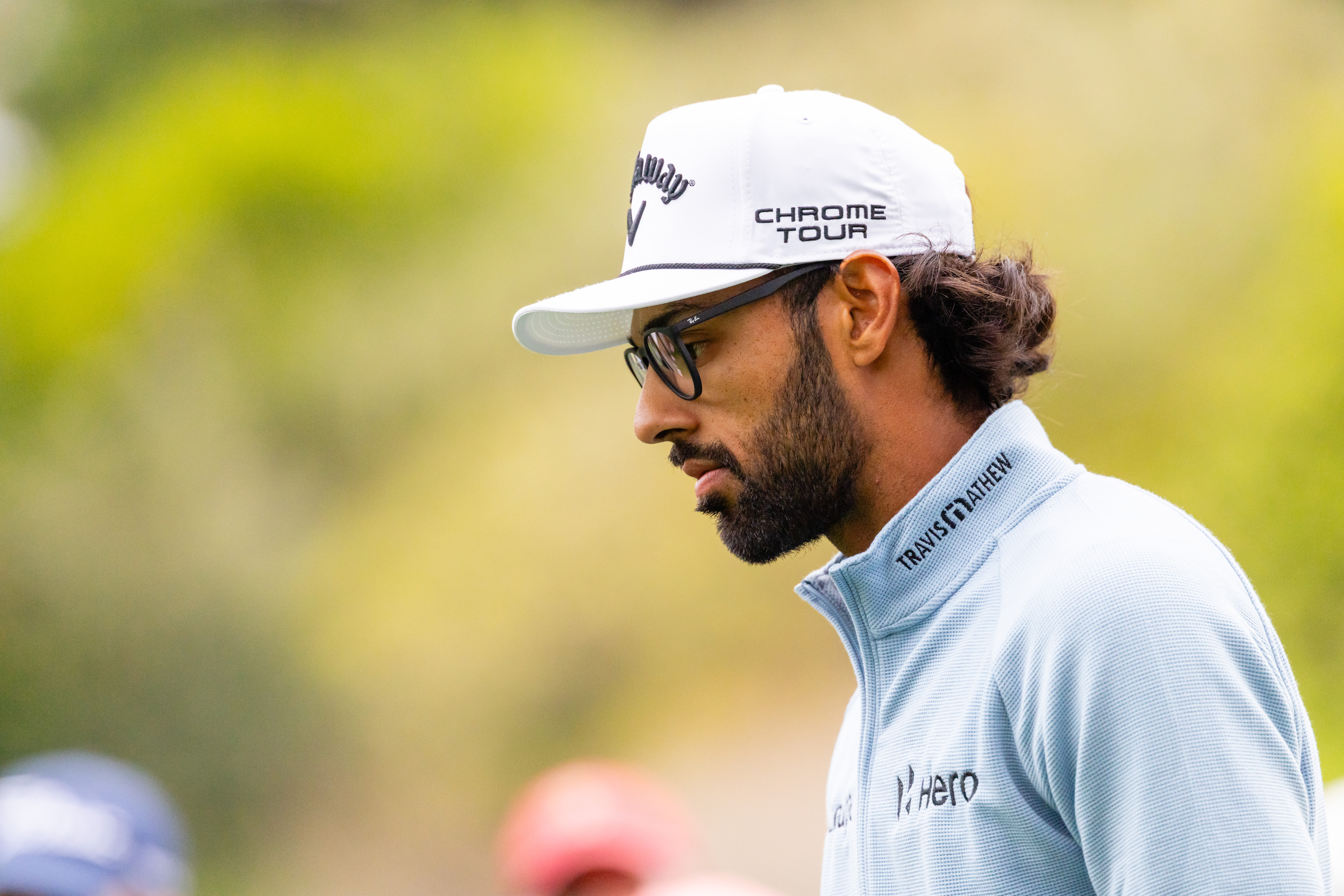 Akshay Bhatia looks on as he walks off the green