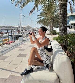 Influencer styles a polka dot dress.