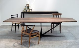 Wooden dining table with two chairs and sideboard