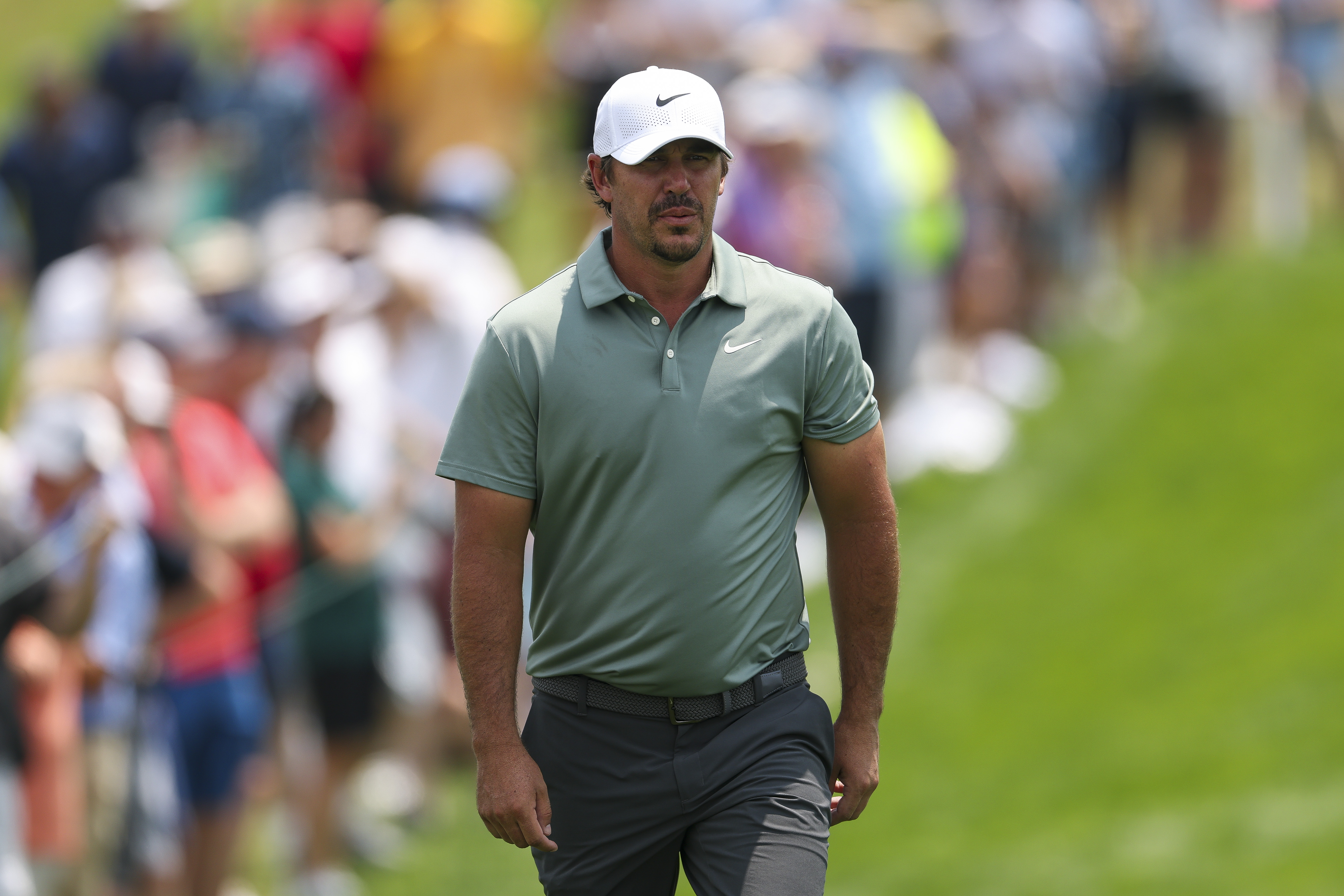 Brooks Koepka walks down the fairway