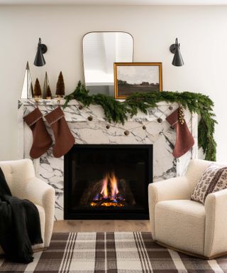 Christmas stockings over fireplace designed by Shea McGee
