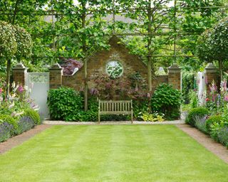 Narrow garden with borders and bench