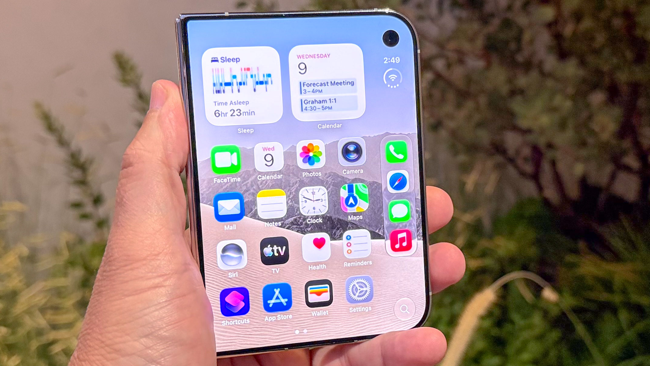 Apple iPhone Duo shown in hand