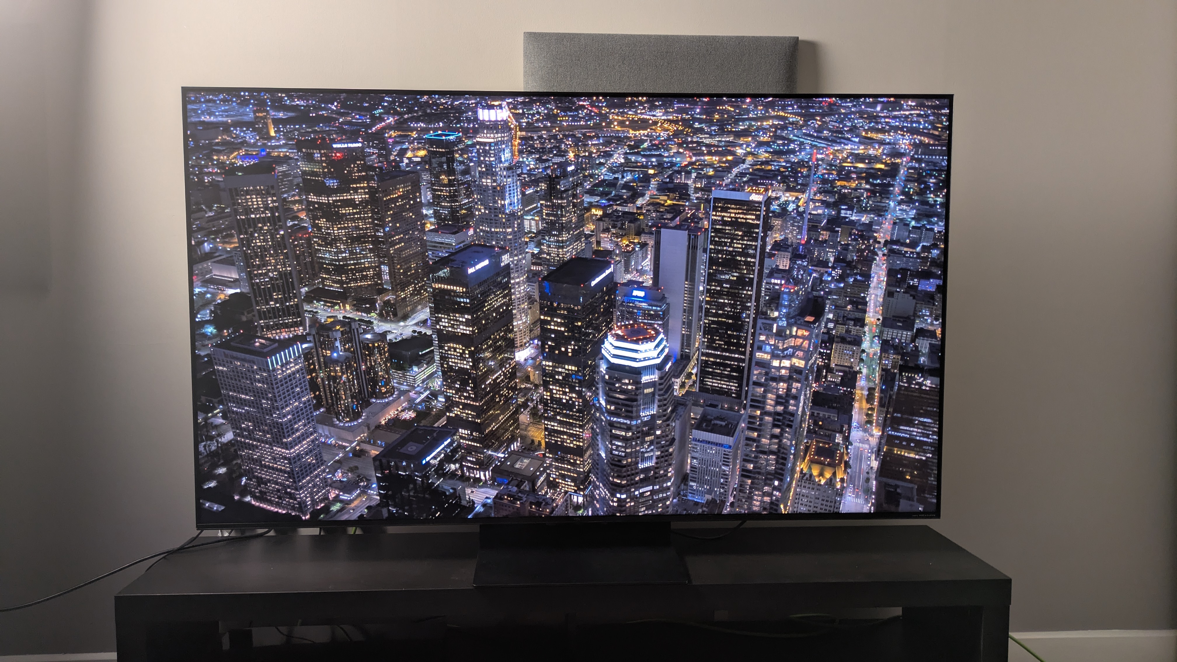 TCL C7K with city at night on screen