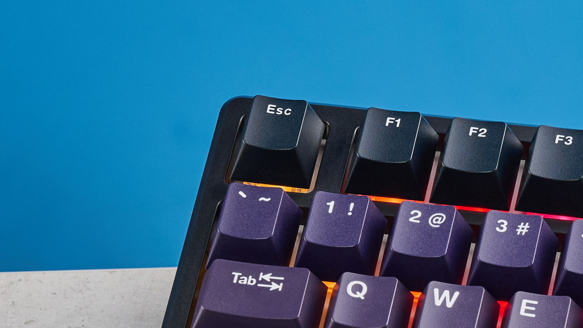 The Epomaker HE75 Mag on a stone surface with a blue background