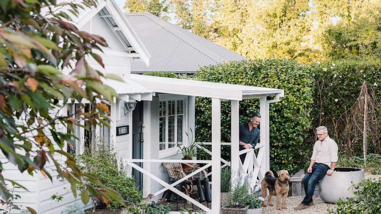 exterior of white weatherboard cottage with a porch