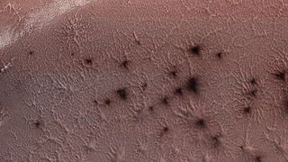 NASA's Mars Reconnaissance Orbiter captured this image of the "spiders" at Mars' south pole on May 13, 2018.