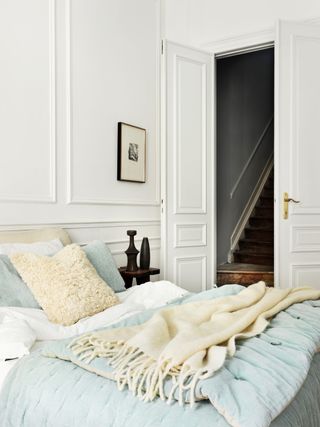 White bedroom by The French bedroom Company with duck egg throw and cream cushions