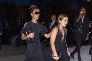 Victoria and Harper Beckham walking