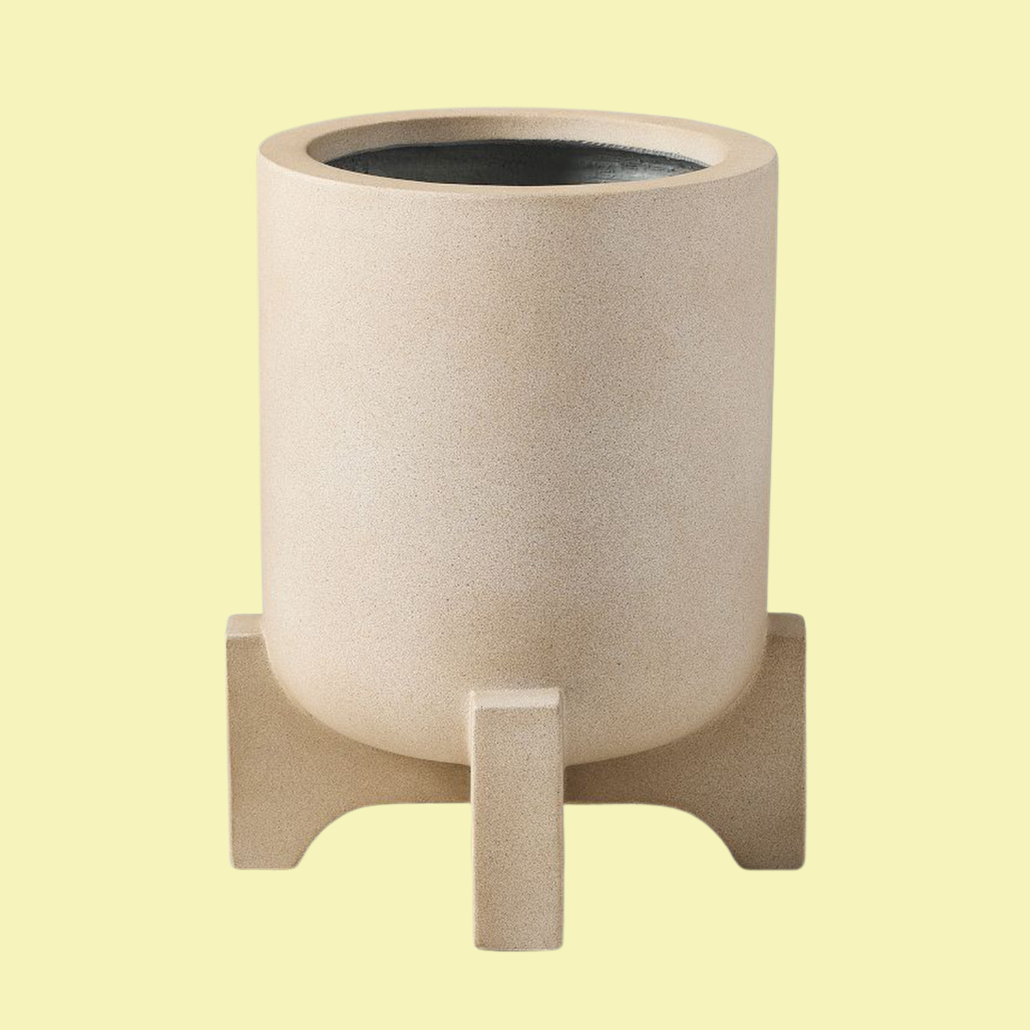 A beige footed planter