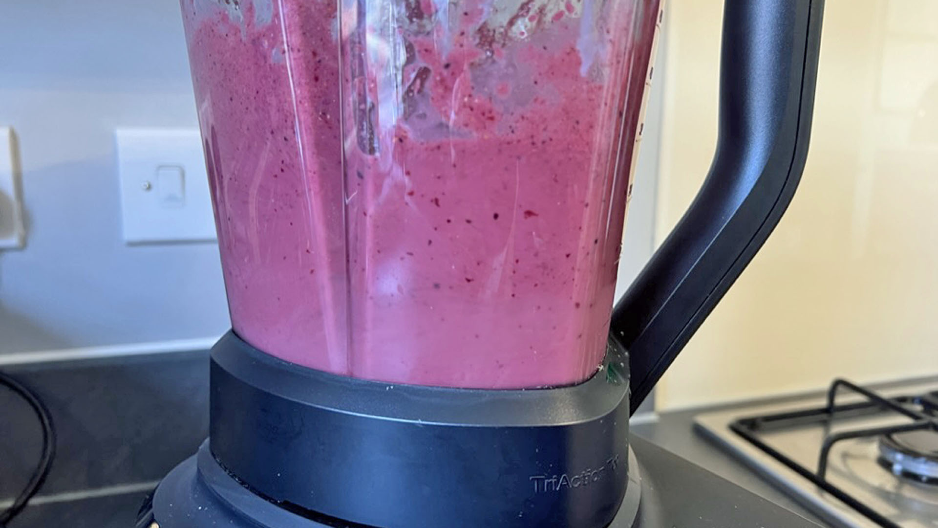 frozen berry smoothie in blender ready to drink