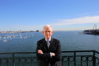 Renowned investment manager Jeremy Grantham poses on a balcony at his Rowes Wharf office in Boston