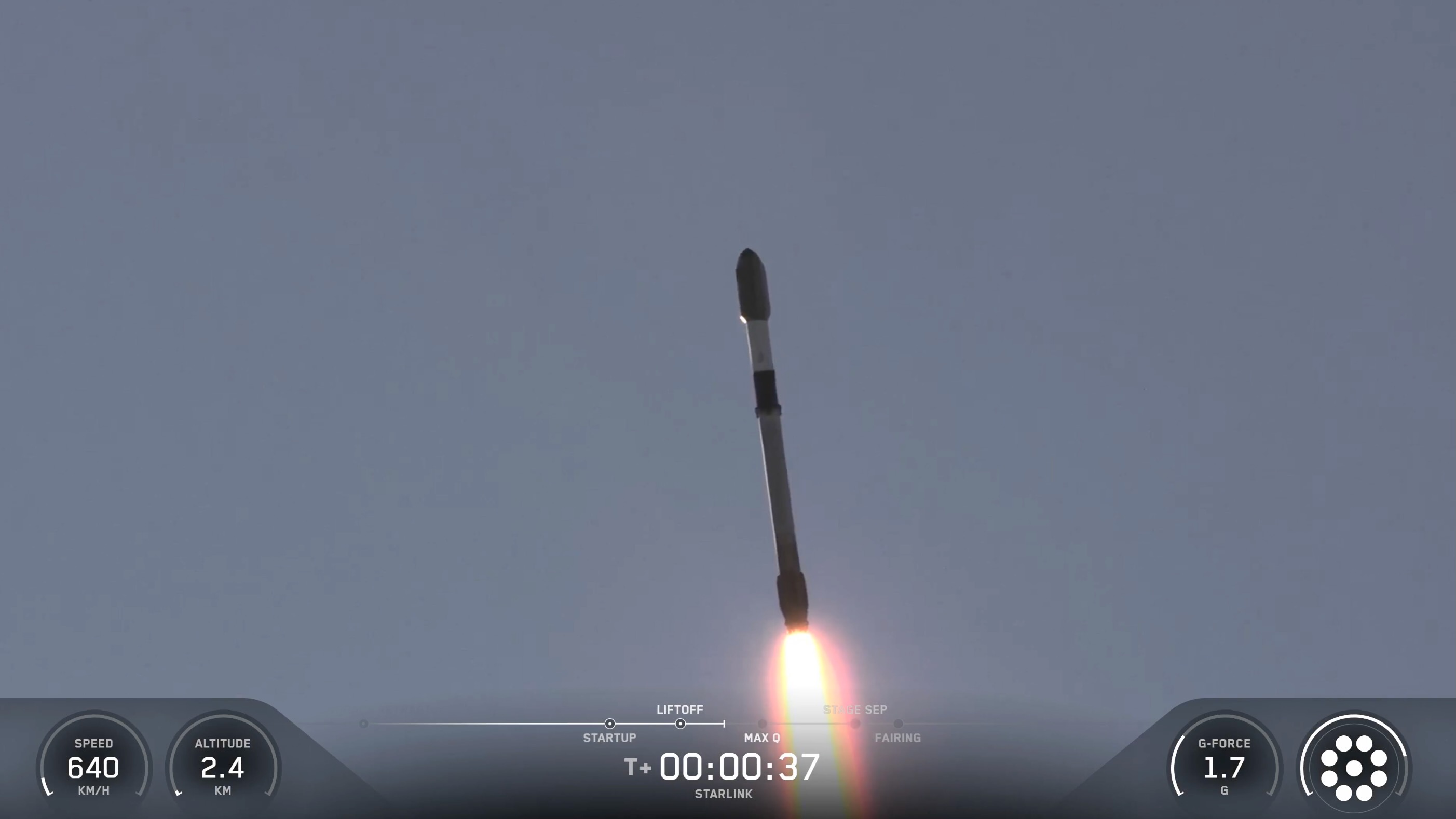 a black and white rocket rises into a blue sky