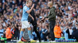Erling Haaland embraces Pep Guardiola after scoring twice for Manchester City against Brighton and coming off late in the game.