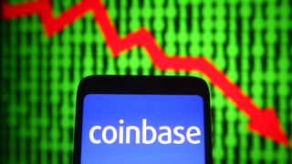 Coinbase logo with downward trend arrow. 
