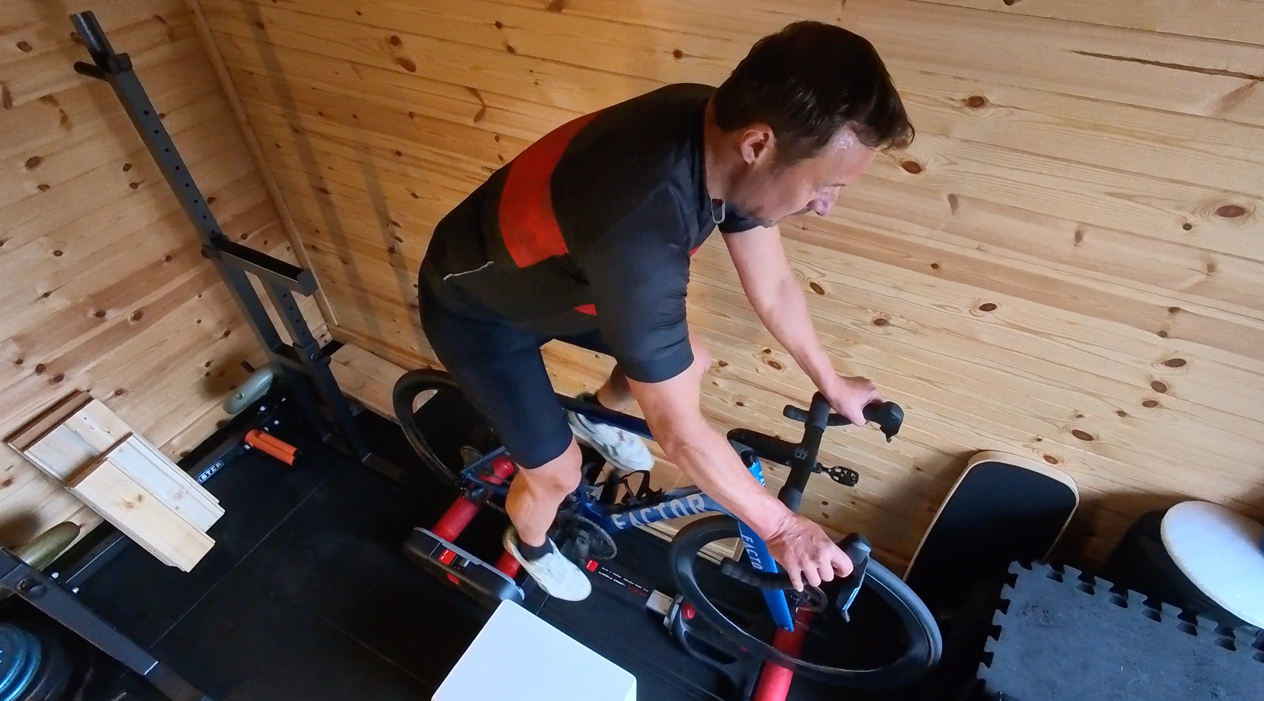 Steve rides the rollers confidently, with the camera capturing him from a bird's eye view