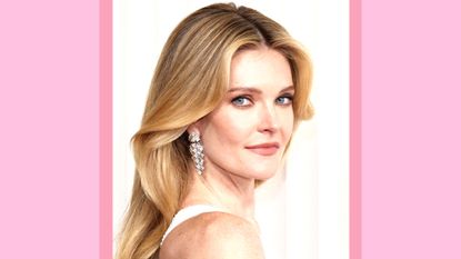 Meghann Fahy wears diamond earrings and white dress as she attends the 29th Annual Screen Actors Guild Awards at Fairmont Century Plaza on February 26, 2023 in Los Angeles, California. / in a pink template