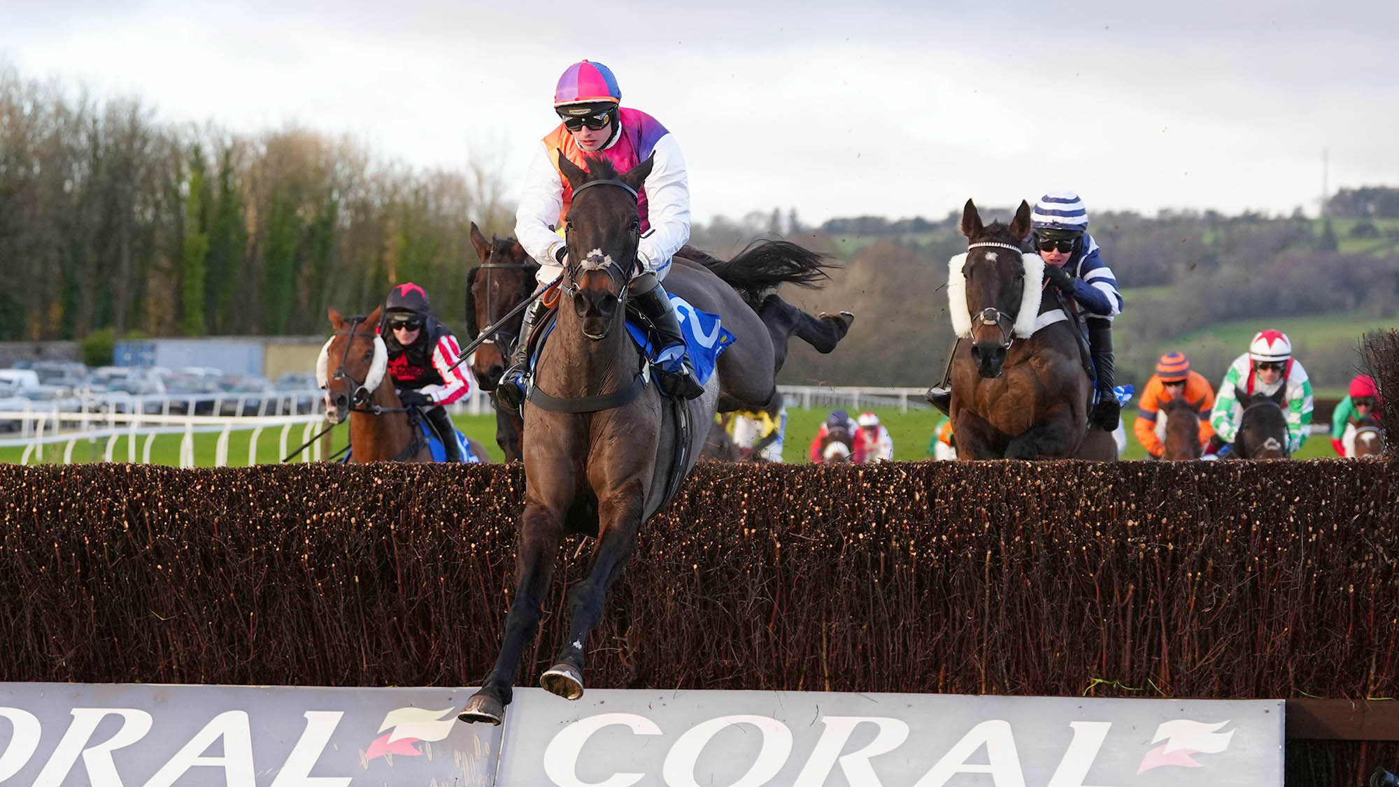 Haiti Couleurs (centre) ridden by jockey Sean Bowen on their way to winning the Coral Welsh Grand National Handicap Chase at Chepstow Racecourse.