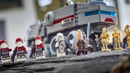Lego Juggernaut vehicle on a rocky outcrop with Clone, Jedi, and Battle Droid minifigures