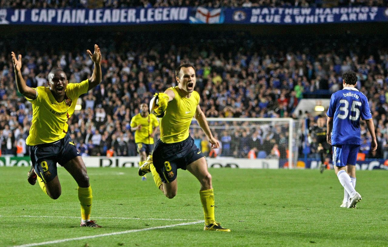 Andres Iniesta of Barcelona celebrates, with his shirt removed, alongside teammate Samuel Eto'o after scoring the winning goal on aggregate in the Champions League semi-final second leg match against Chelsea at Stamford Bridge, May 2009