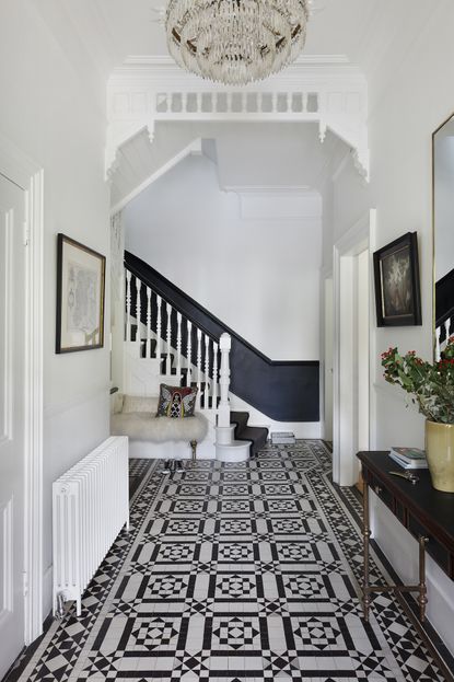 Black and white hallway with patterned tiles