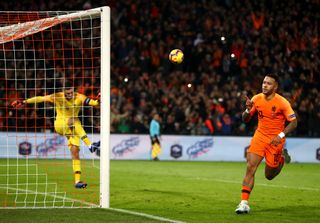 Memphis Depay celebrates after scoring a penalty for the Netherlands against France as goalkeeper Hugo Lloris kicks the ball away in frustration in the UEFA Nations League in November 2018.