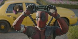 Wade Wilson holding up phone in Deadpool 2