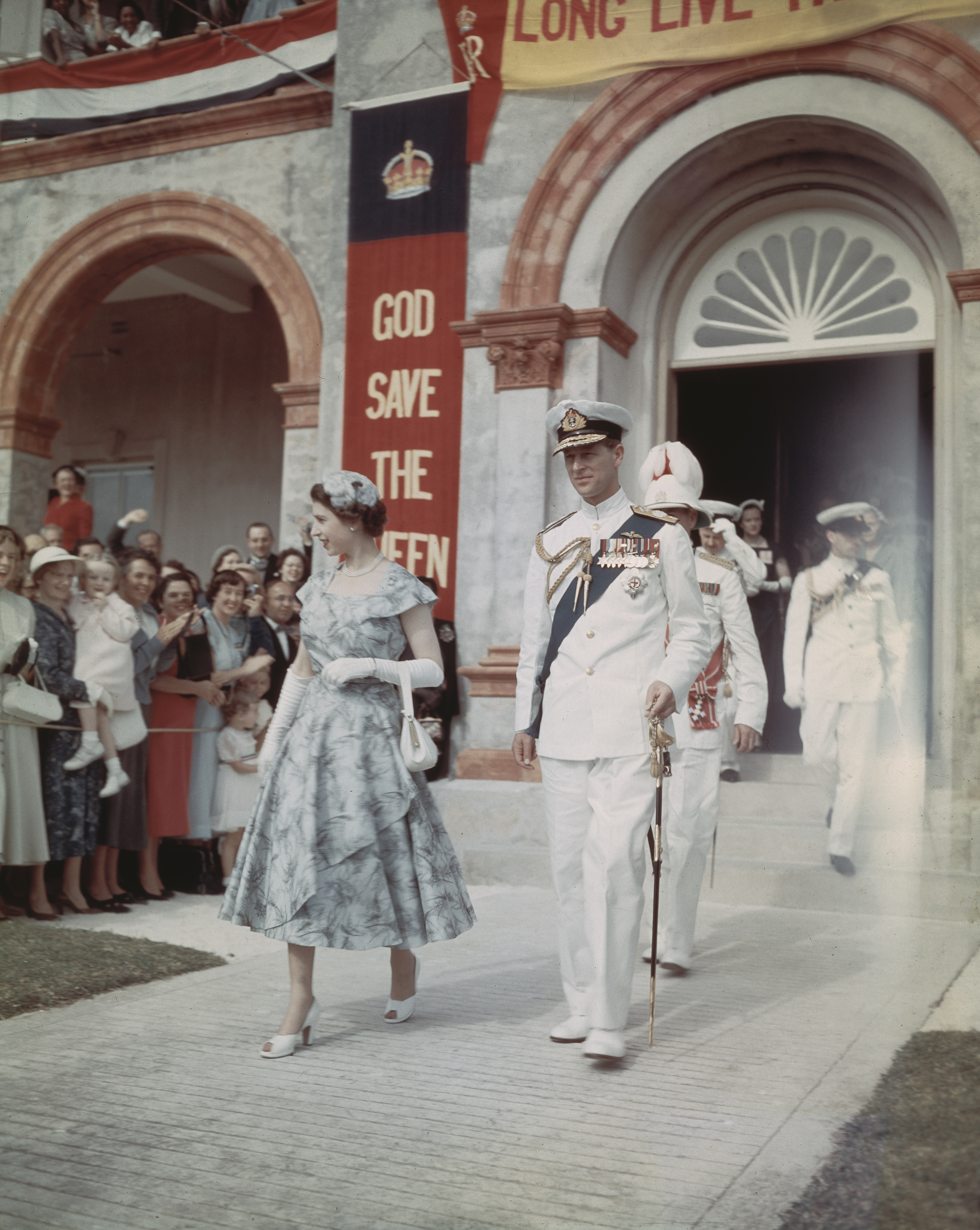 Queen Elizabeth II and Prince Philip, Duke of Edinburgh leave the House of Assembly in Hamilton, Bermuda, during a six-month tour of the Commonwealth nations, November 1953