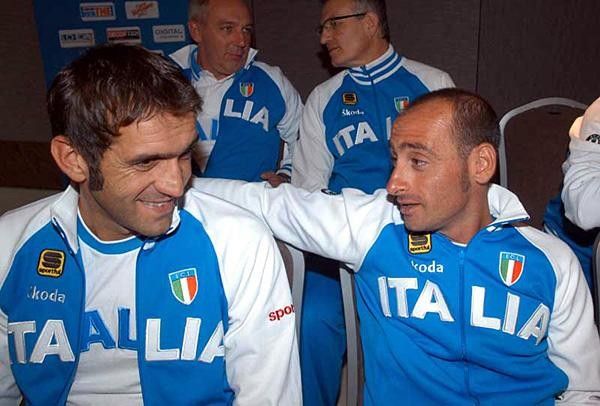 Franco Ballerini consults with one of his top men, Paolo Bettini
