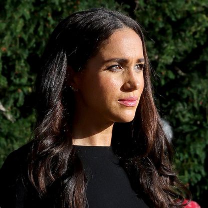 Meghan Markle and Prince Harry wear black as they view tributes at Windsor Castle to Queen Elizabeth, who died on September 8, 2022