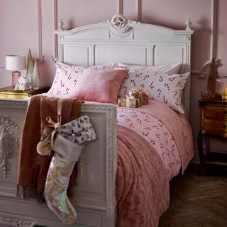 Christmas bedroom with pink candy can bedding