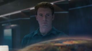 Steve Rogers looking at hologram of Thanos' hideout planet