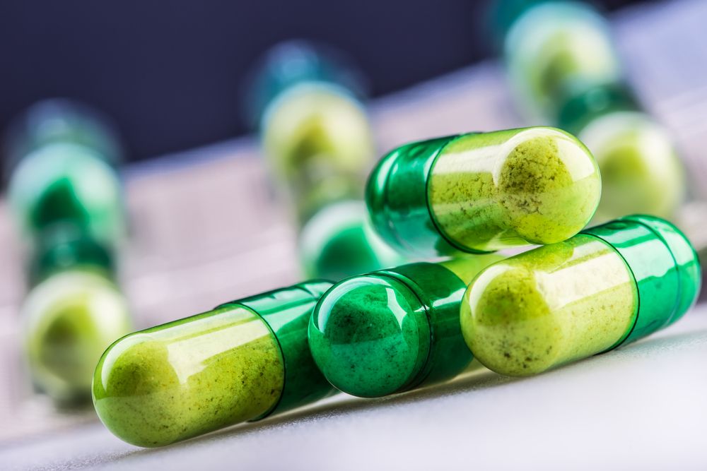 a pile of medicine in the form of capsules