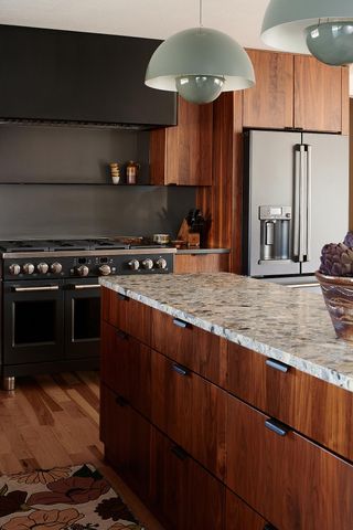 A kitchen with stone countertop