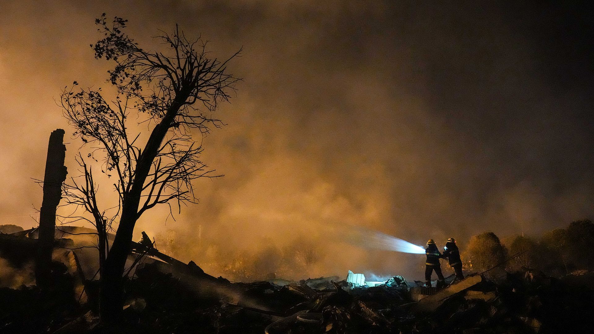 
                                Fire and rescue teams extinguish the last of the flames after an explosion at a fireworks plant in Liuyang, China
                            